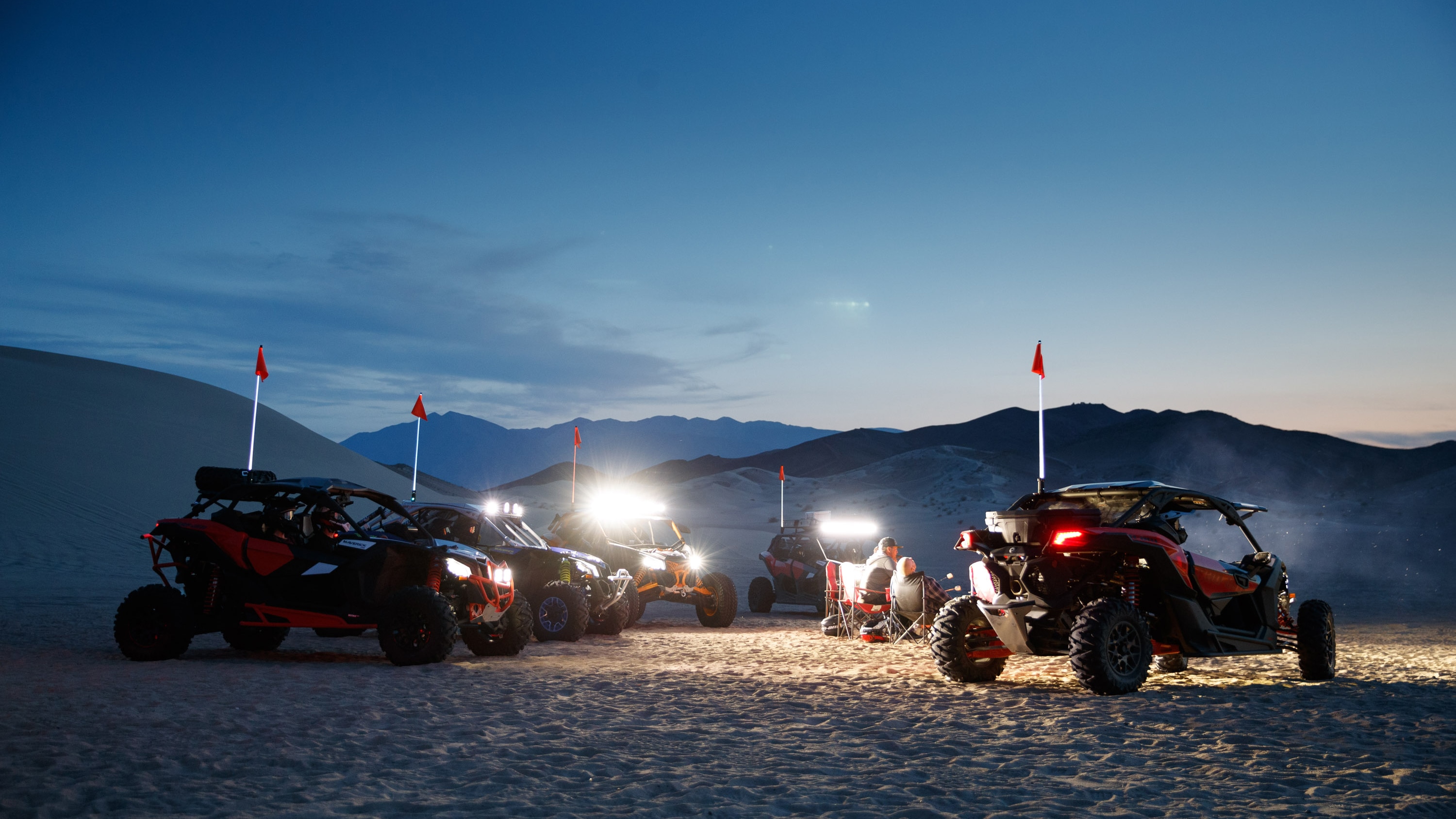 Five Maverick models at night in the desert