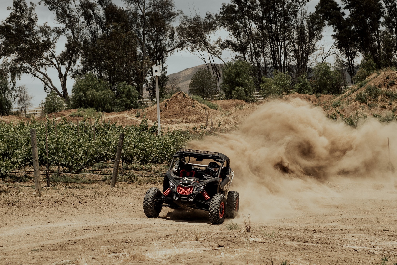 Two men in a Maverick X RC in the desert