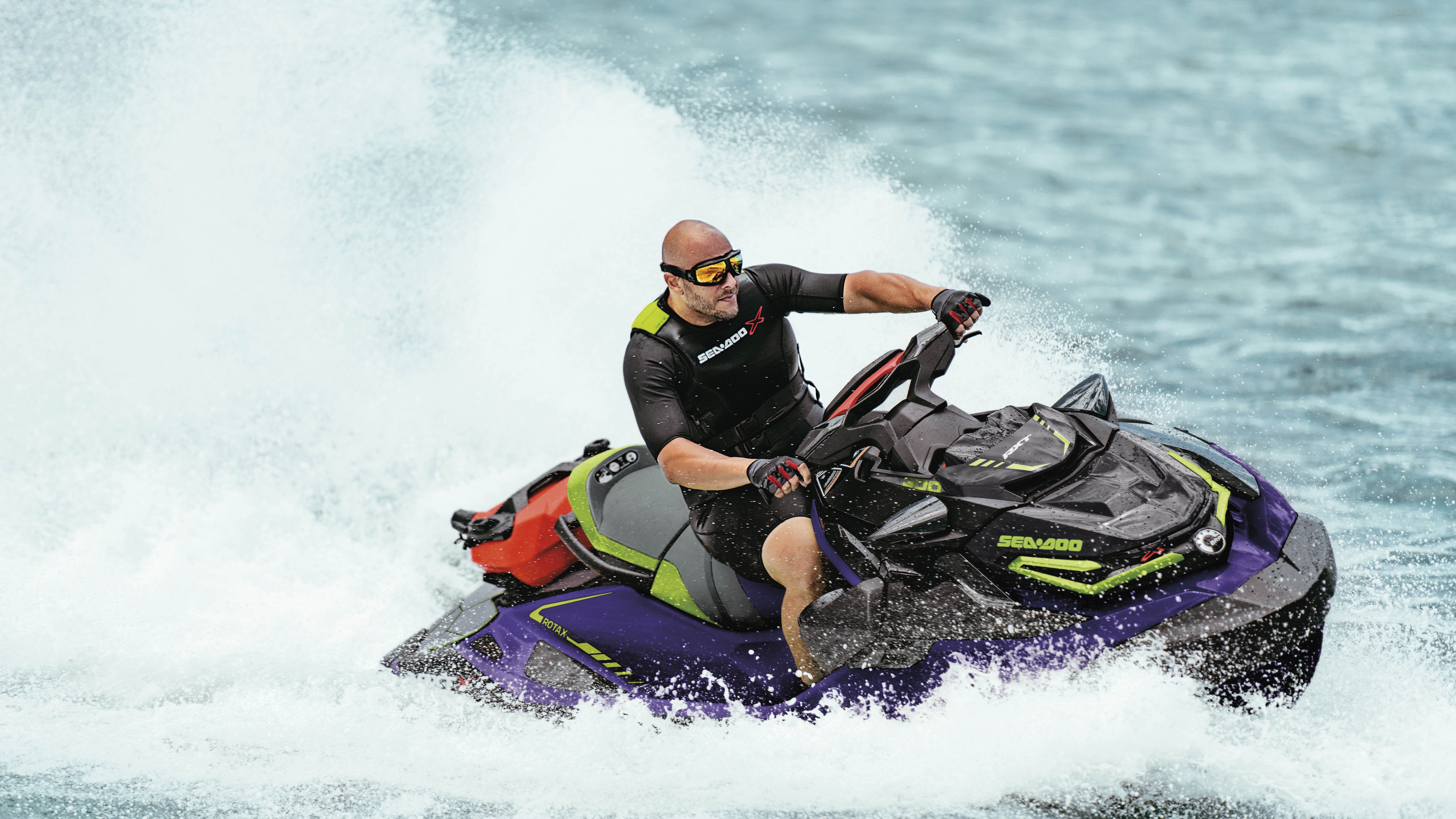 Man carving with a Sea-Doo RXT-X and the large swim platform