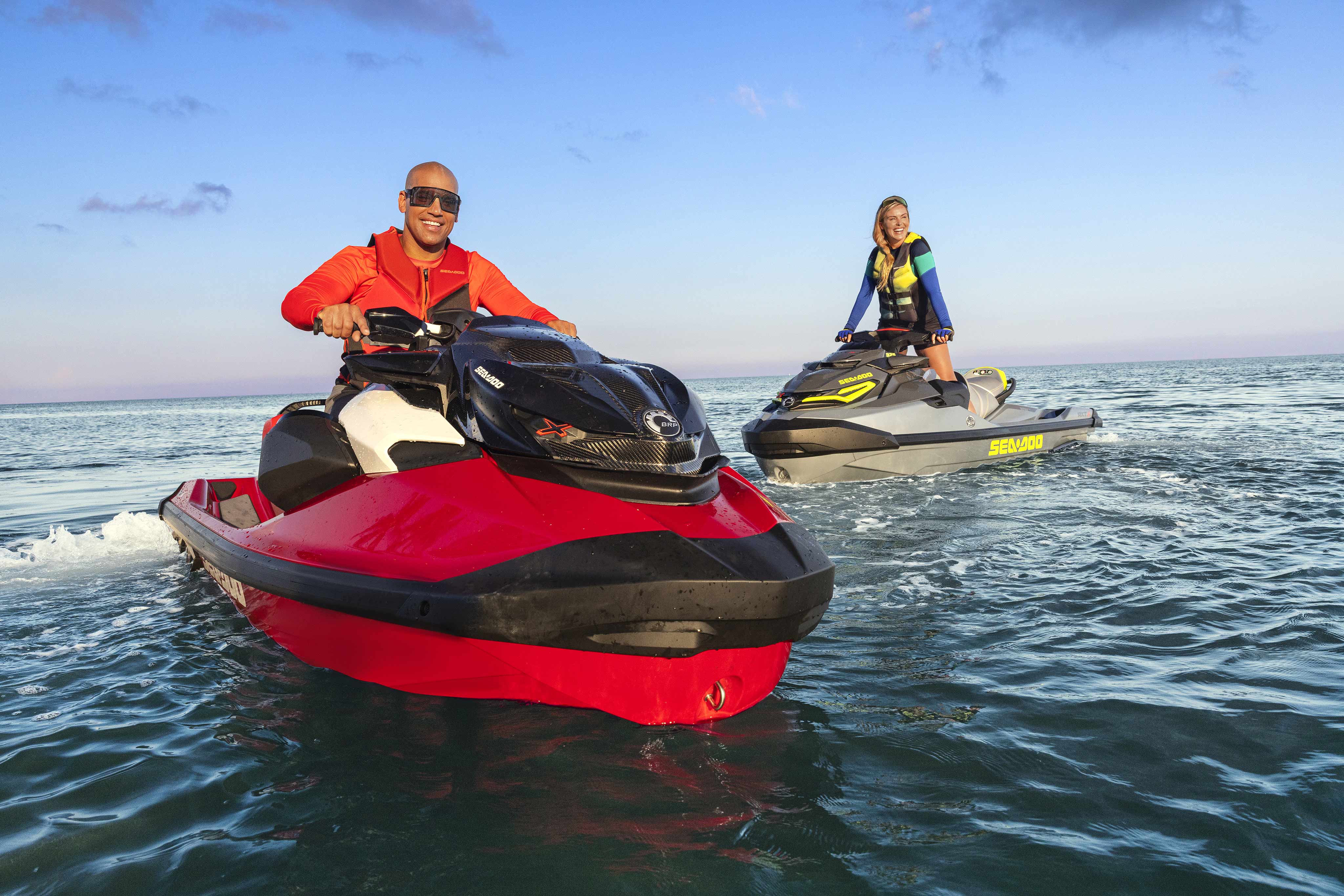 Three friends with two Sea-Doo Spark personal watercrafts