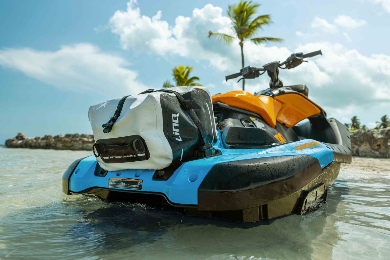 Sea-Doo watercraft with LinQ Waterproof Bag on beach in tropical setting