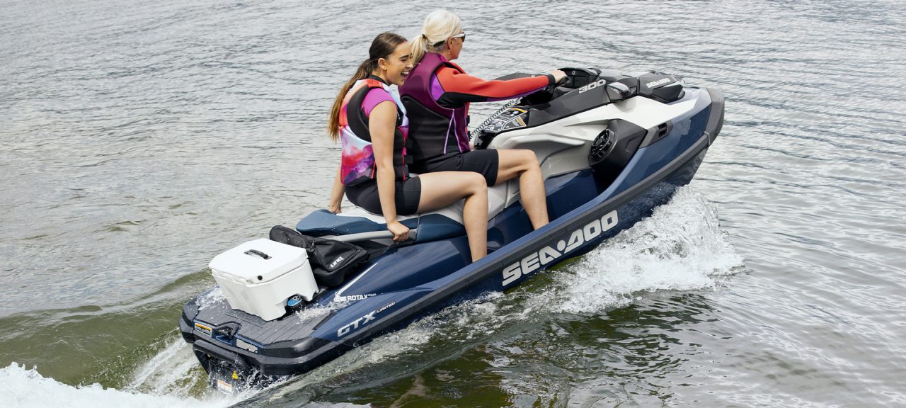 Two people ride one Sea-Doo watercraft