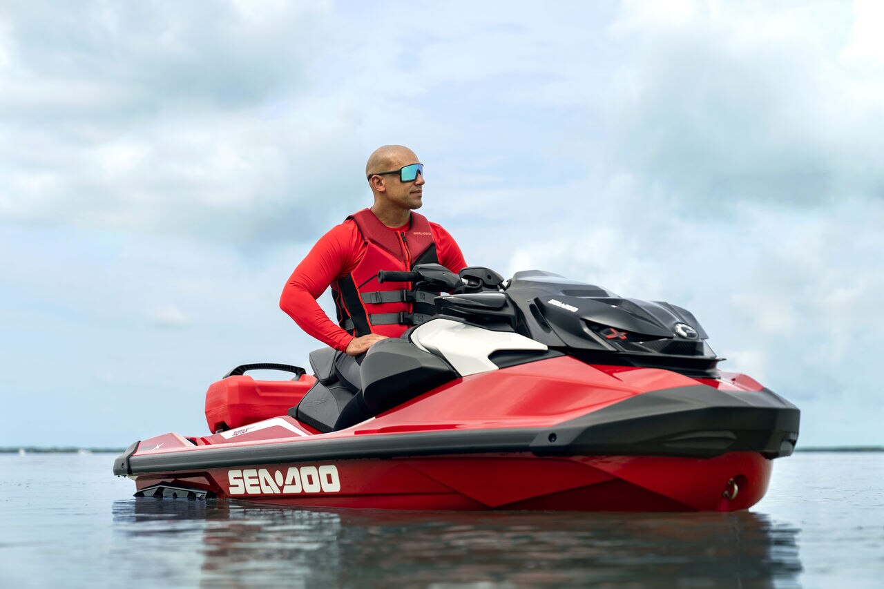 Man sitting on an idle Sea-Doo RXP-X RS personal watercraft