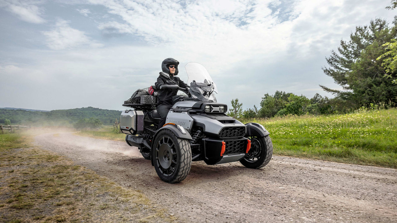 Several people taking their Can-Am 3-wheel motorcycle driving test