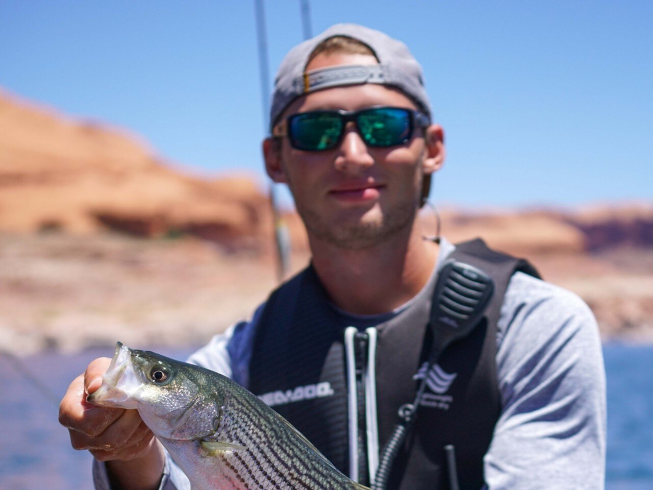 Kyle Naegeli posing with a fish