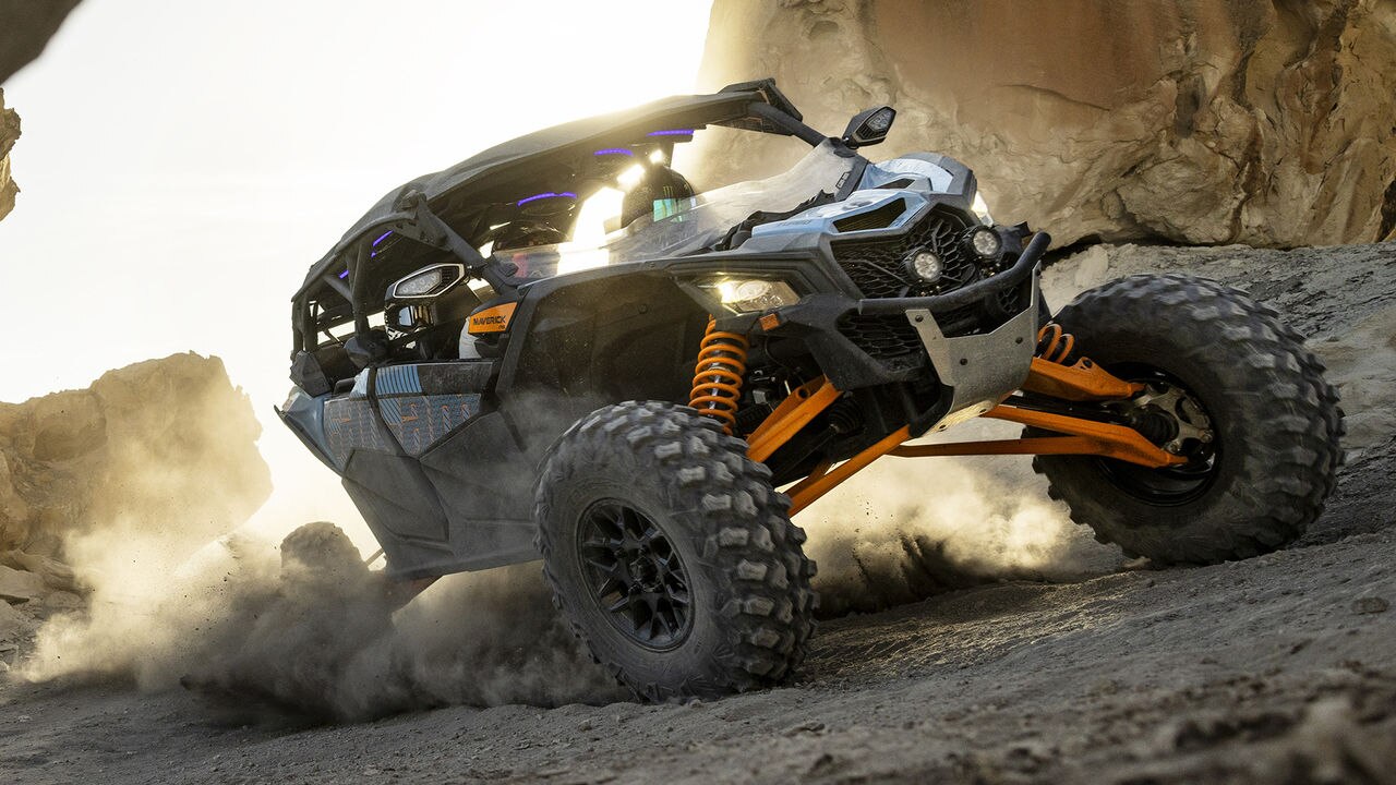 Man driving a Can-Am Maverick in the sand