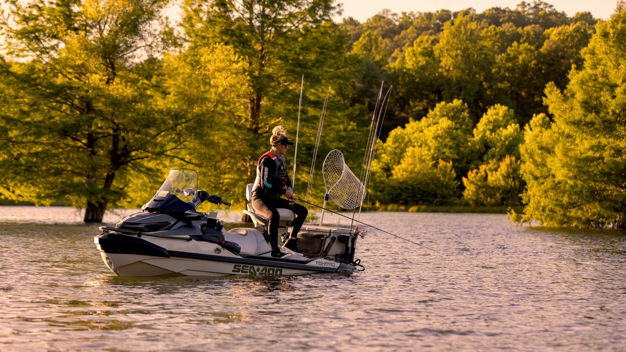 Woman fishing on a Sea-Doo Fishpro Apex 300