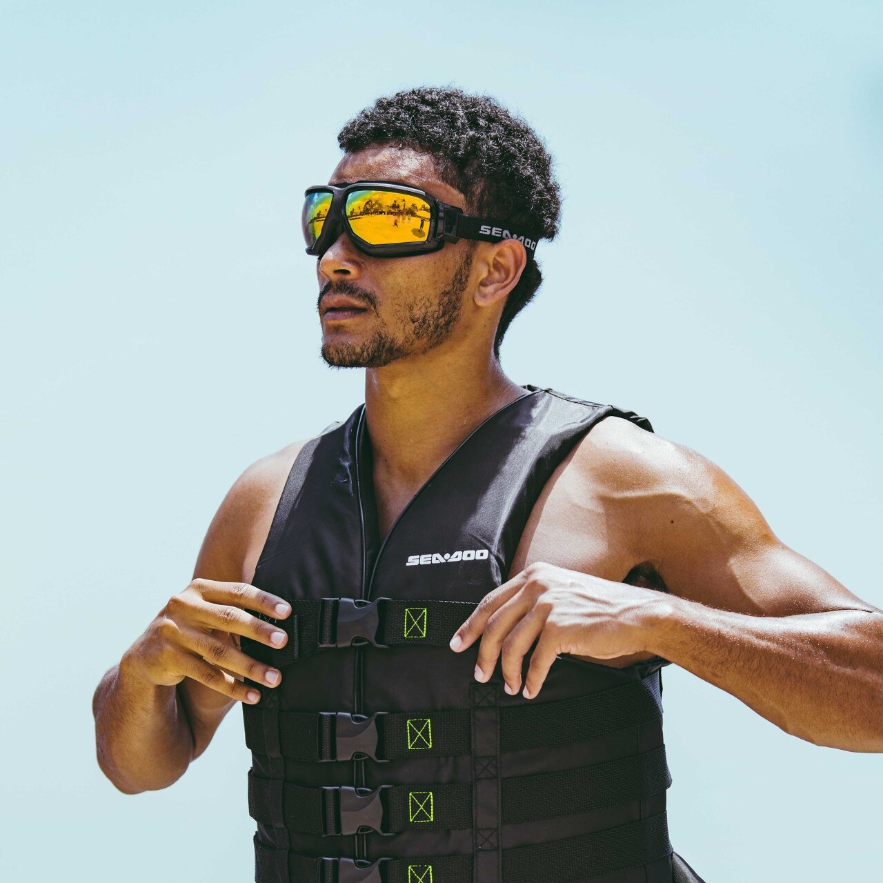 Man with a Sea-Doo sunglases and life jacket