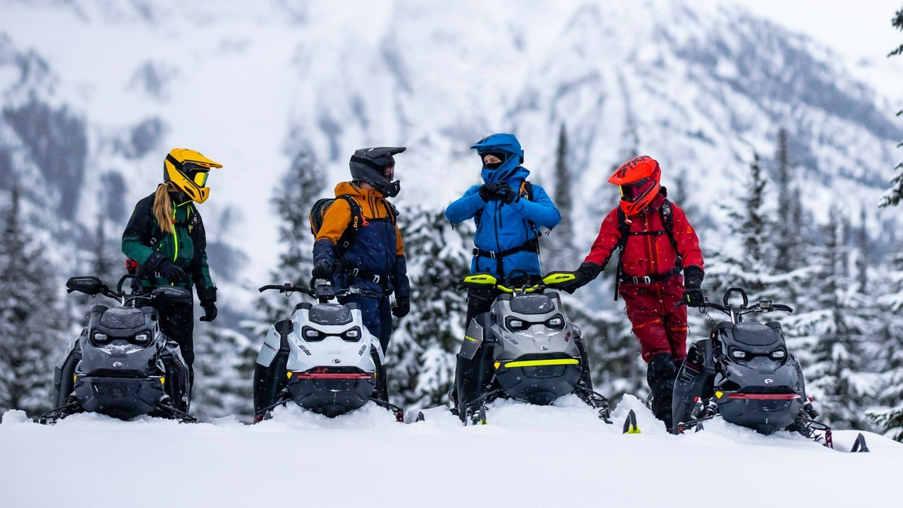 Family enjoying new Ski-Doo snowmobile lineup