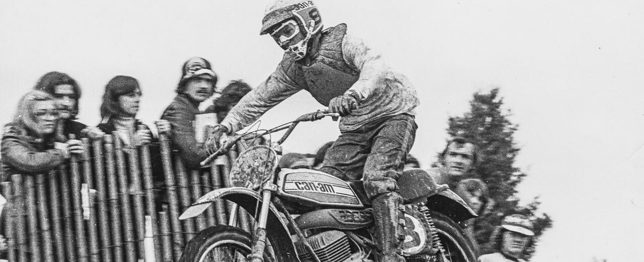 Motocross rider jumping with a classic Can-Am motorcycle