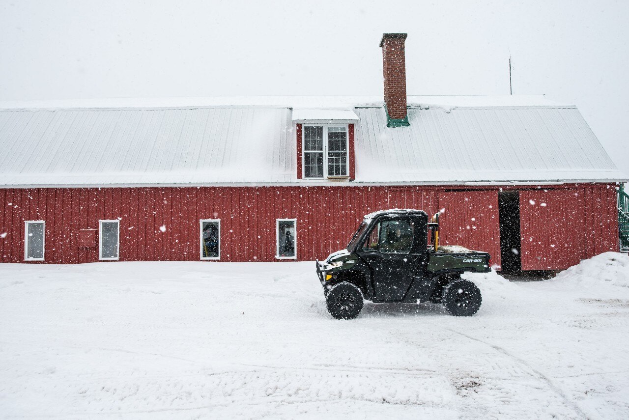 Traxter on snow in a farm