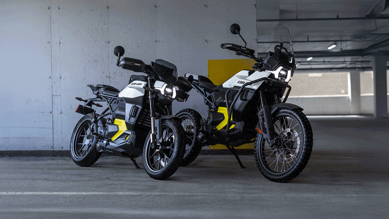 Can-Am Pulse & Origin electric motorcycles parked in a multi-story parking garage