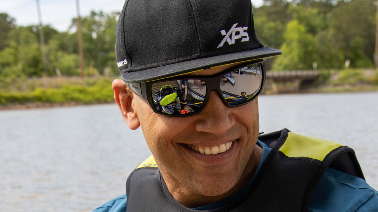 Anthony Radetic smiling with a XPS cap