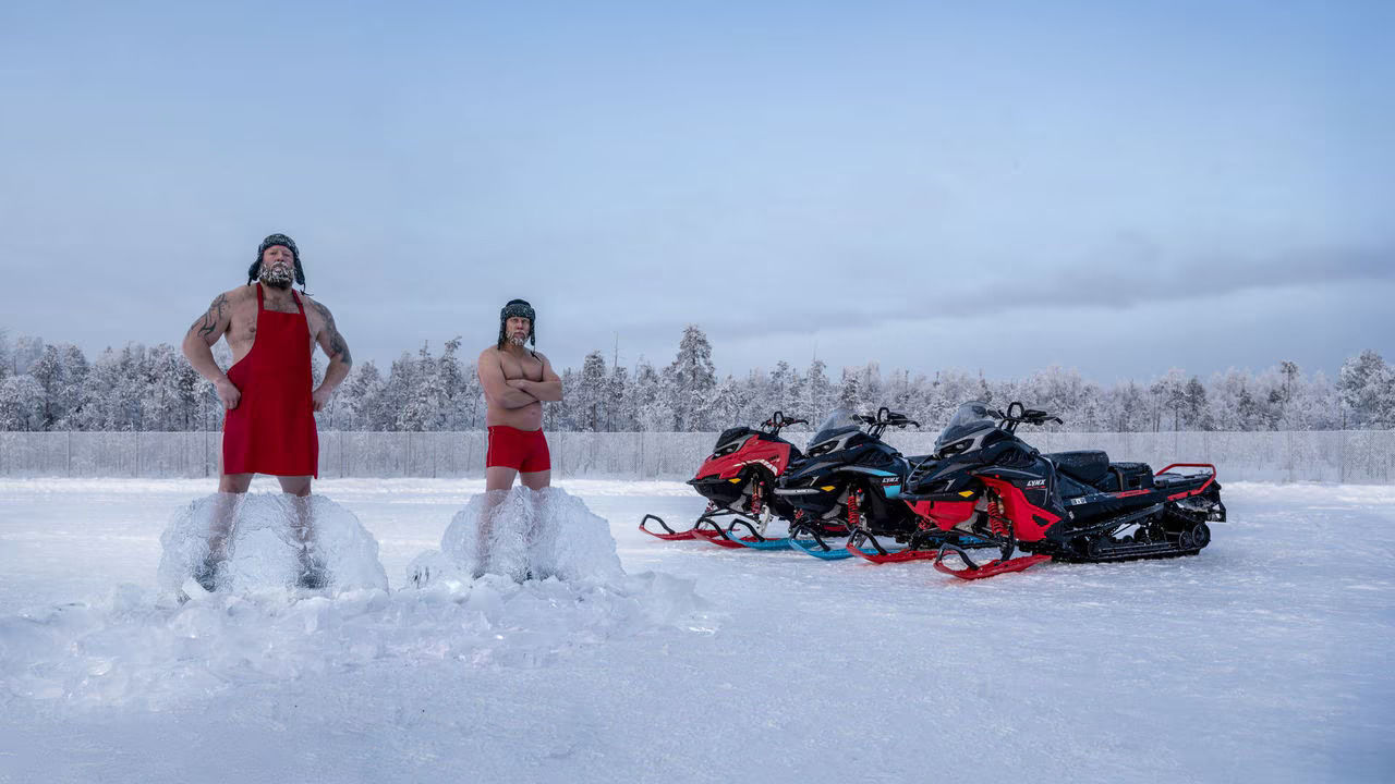 group of people riding Ski-Doo snowmobiles