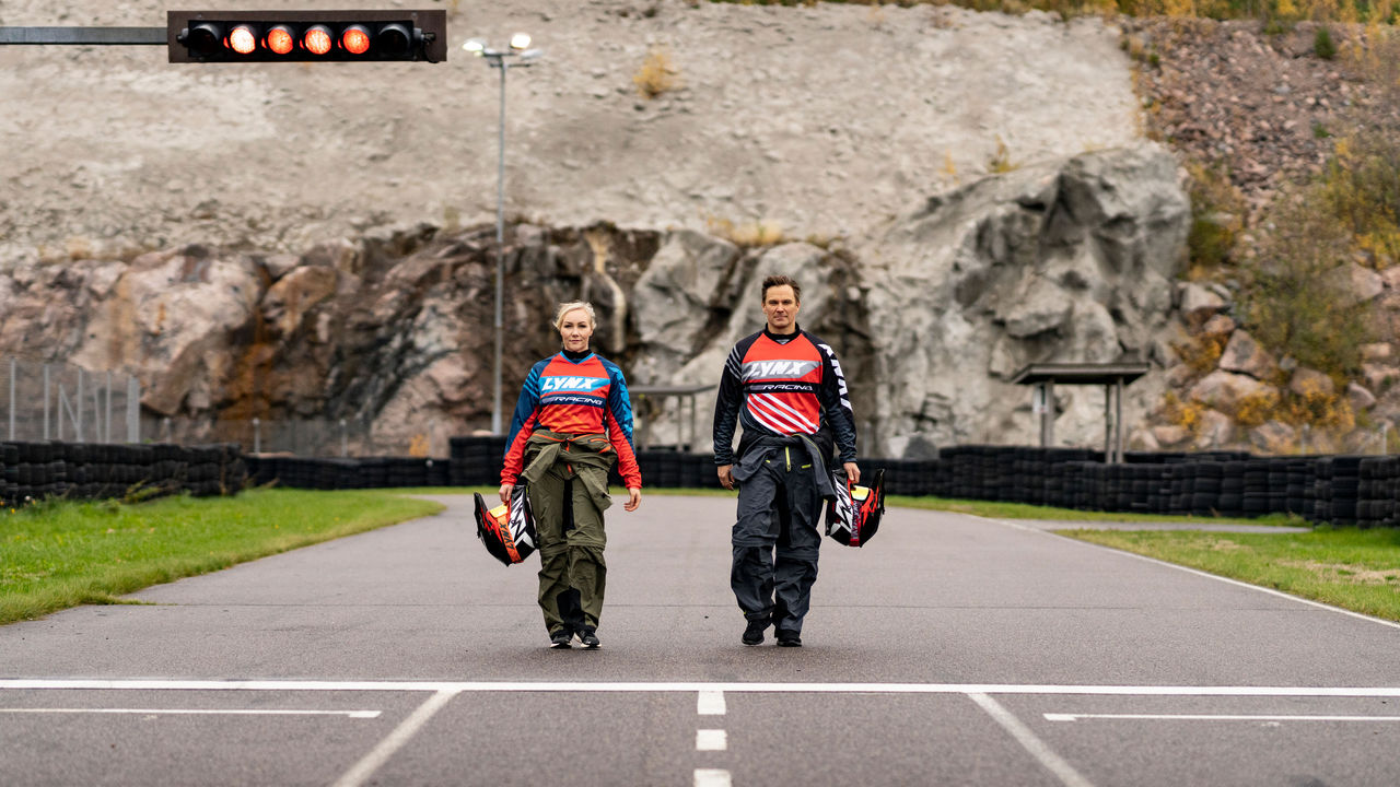 Man and woman walking on the race track