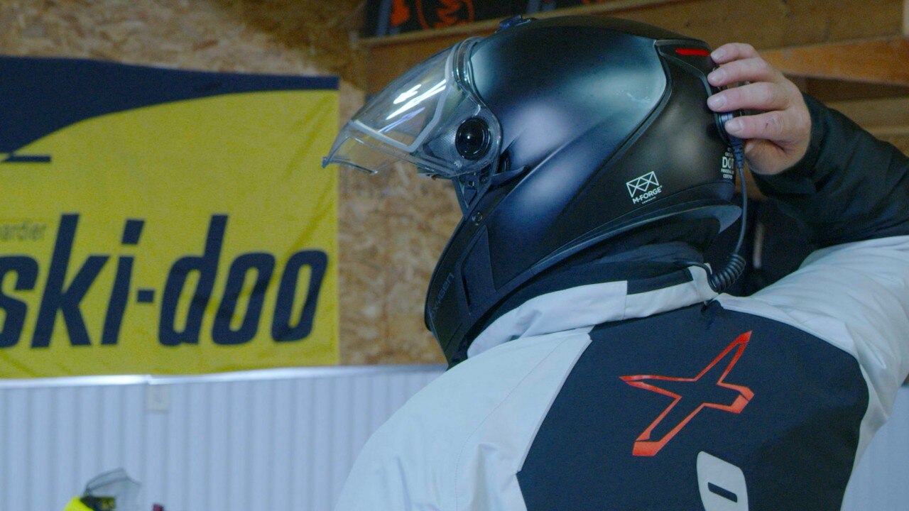Rider using the Ski-Doo E LinQ System