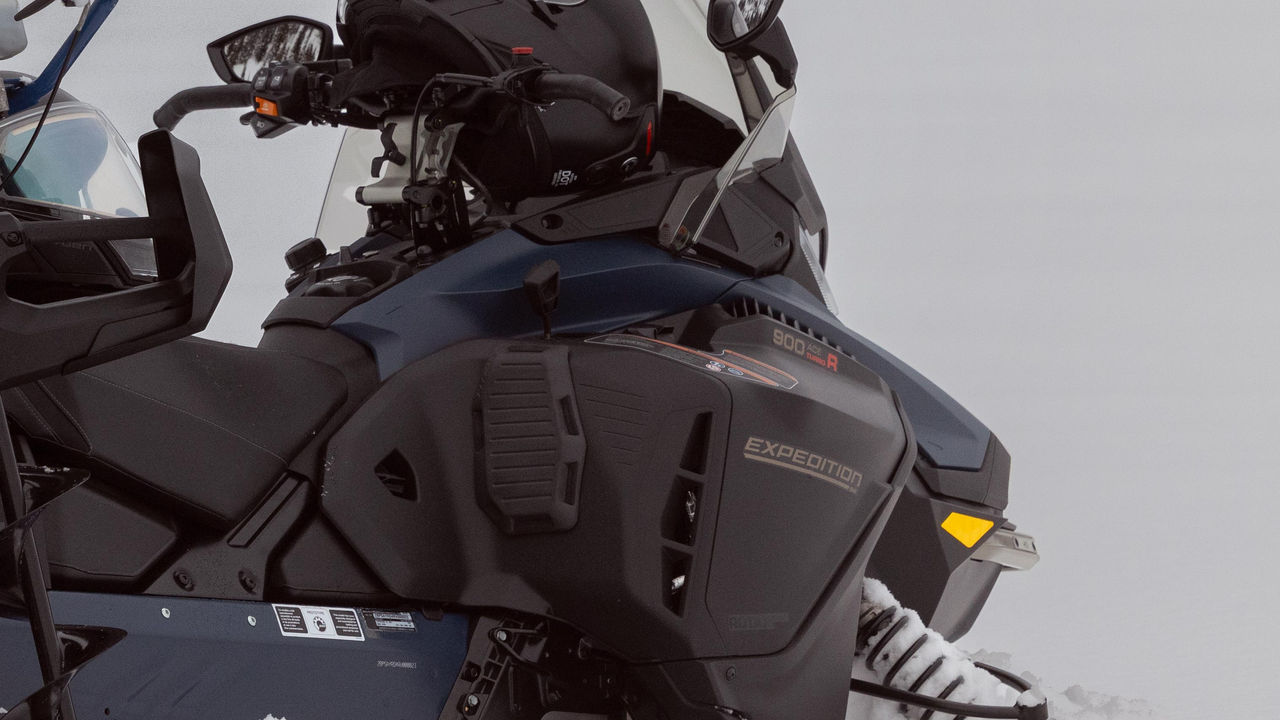 Knee pad protector installed on a 2025 Ski-Doo Expedition crossover snowmobile