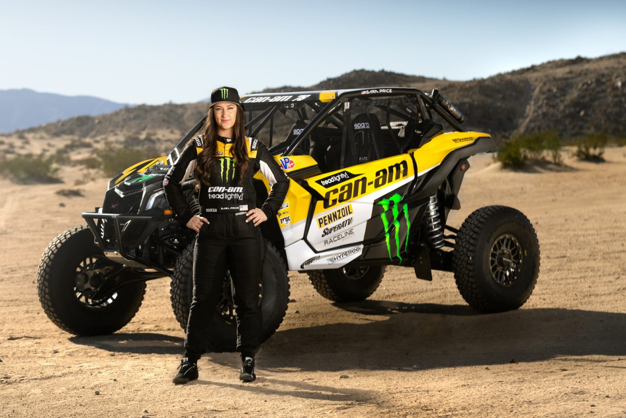 Sara Price standing infront of a side-by-side vehicle