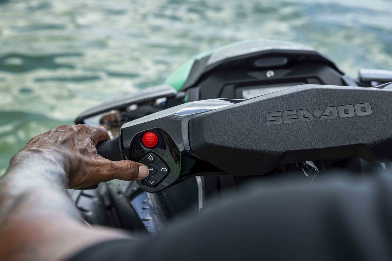 Woman pulling off a trick on a 2025 Sea-Doo Spark Trixx personal watercraft