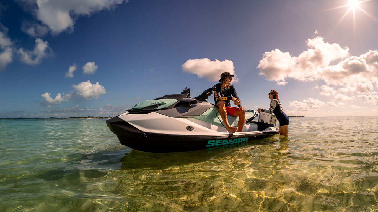 Woman pulling off a trick on a 2025 Sea-Doo Spark Trixx personal watercraft