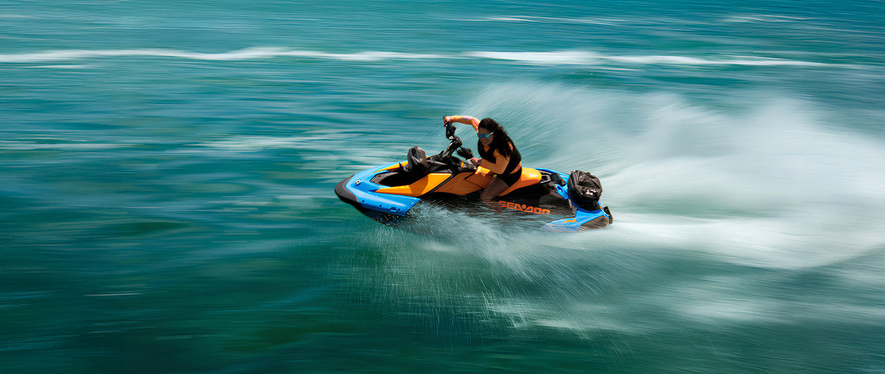 A woman speeding through the water on her 2026 Sea-Doo Spark watercraft