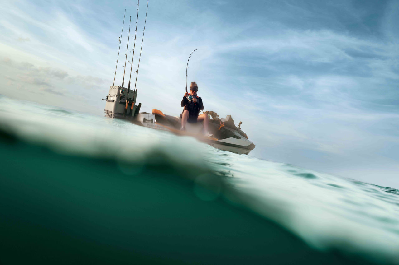 Woman fishing from the 2025 Sea-Doo FishPro Apex personal watercraft