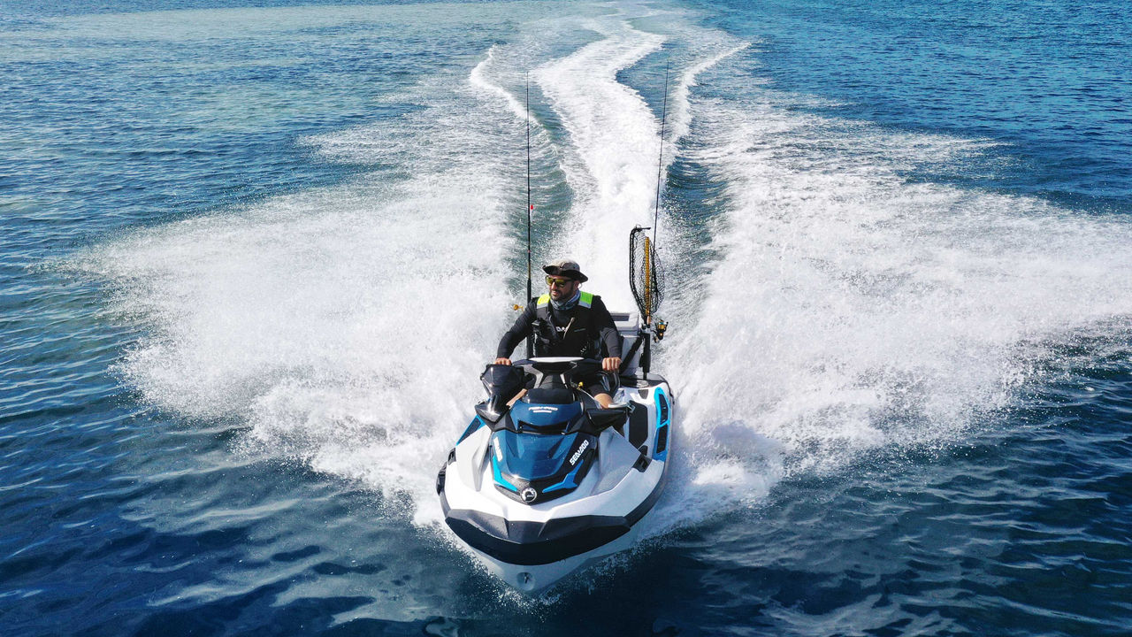 Woman riding the 2025 Sea-Doo FishPro Apex personal watercraft