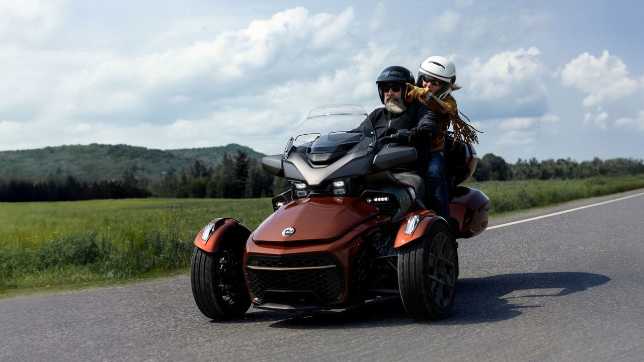 A couple riding a 2026 Can-Am Spyder F3