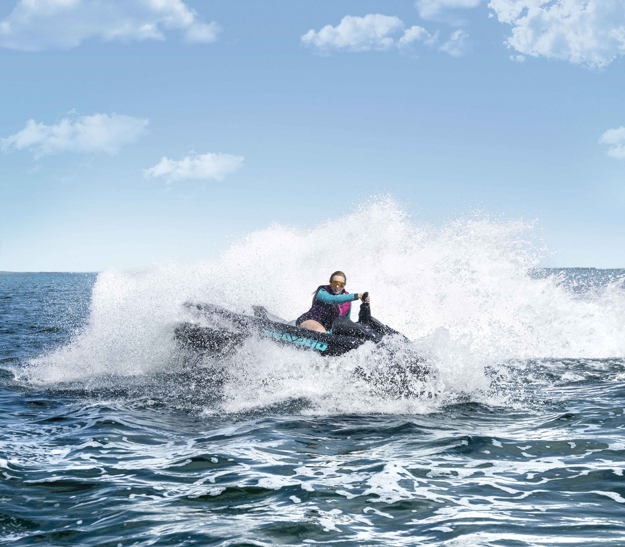 Woman riding a 2024 Sea-Doo GTR personal watercraft