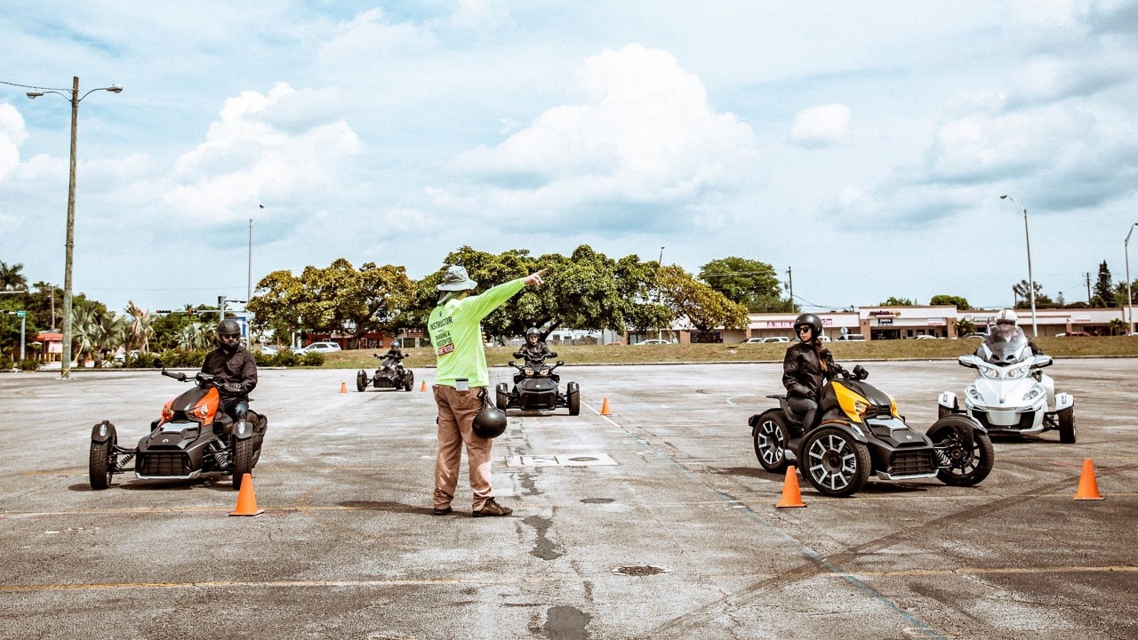 Rider Education Program students learning how to drive 3-wheeled Can-Am Ryker vehicles with their instructor