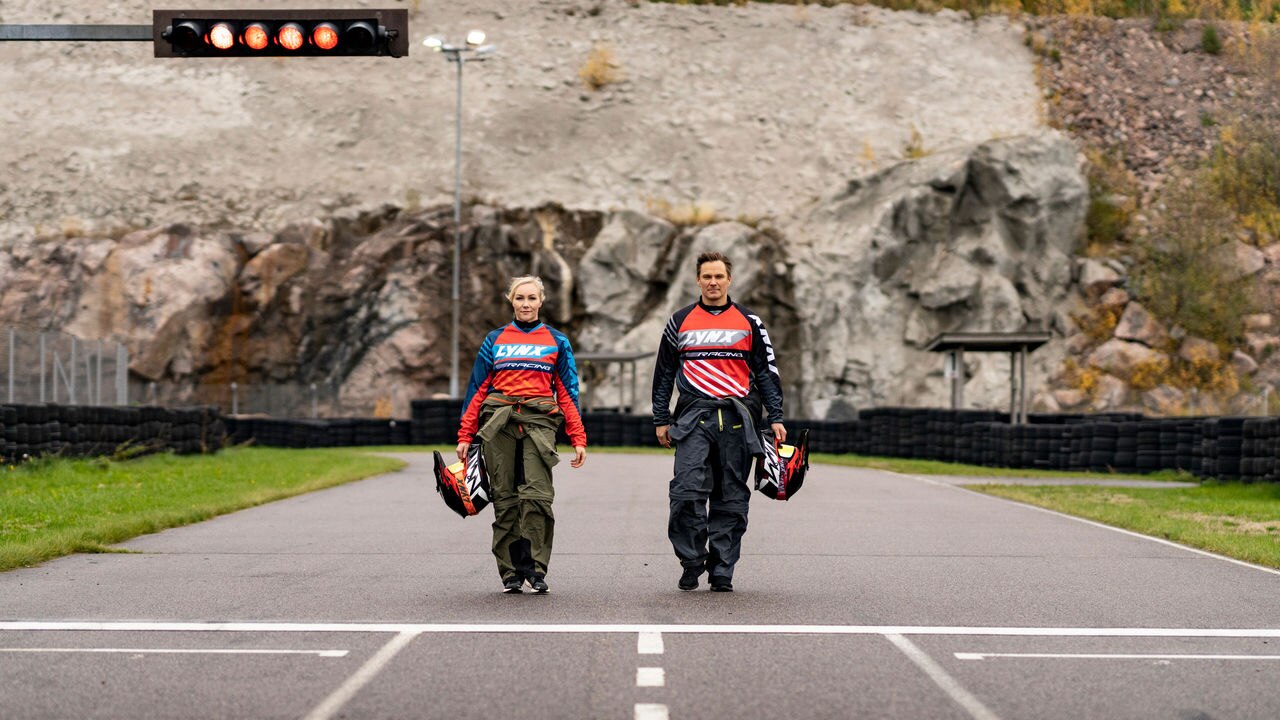 Man and woman walking on the race track