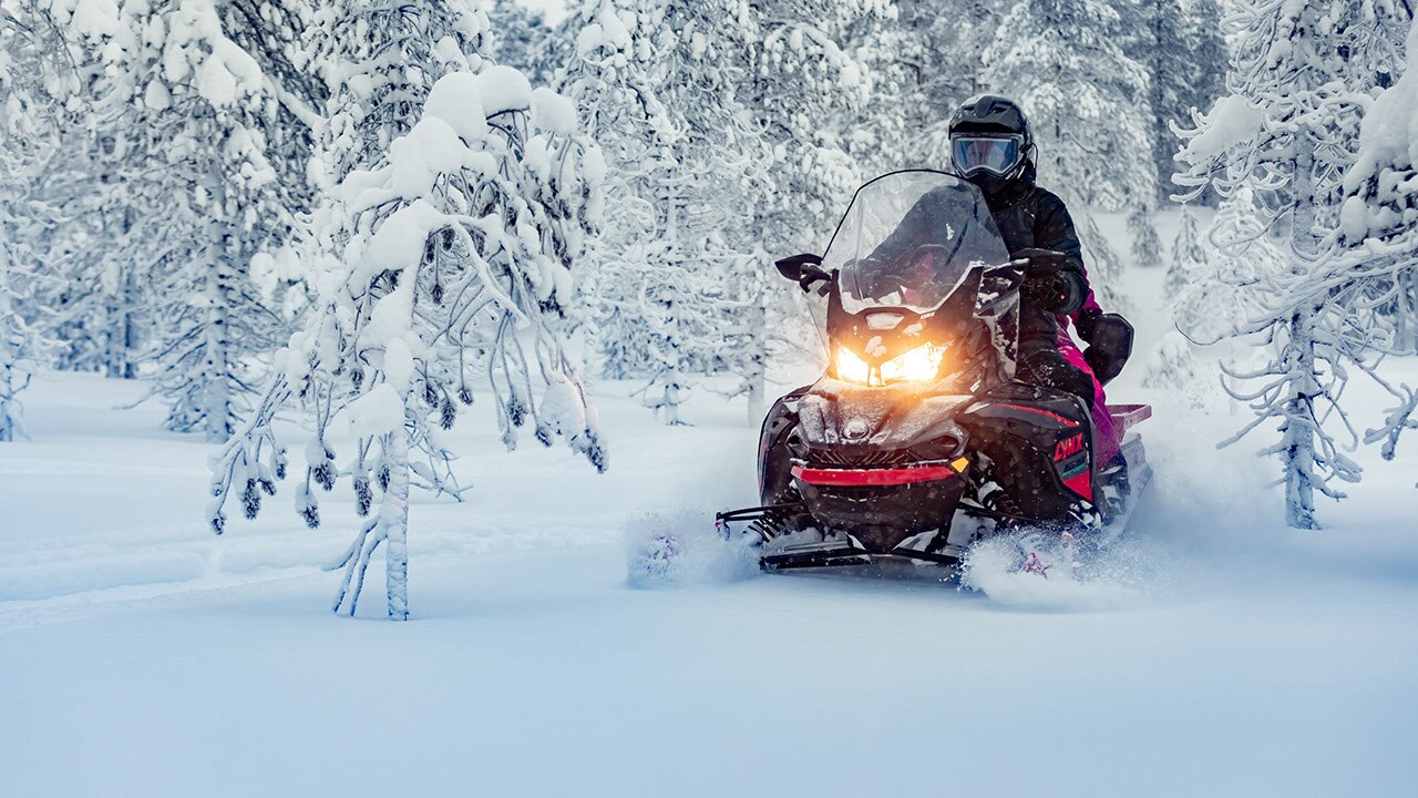 A man is driving his 2021 Lynx 69 Ranger Model