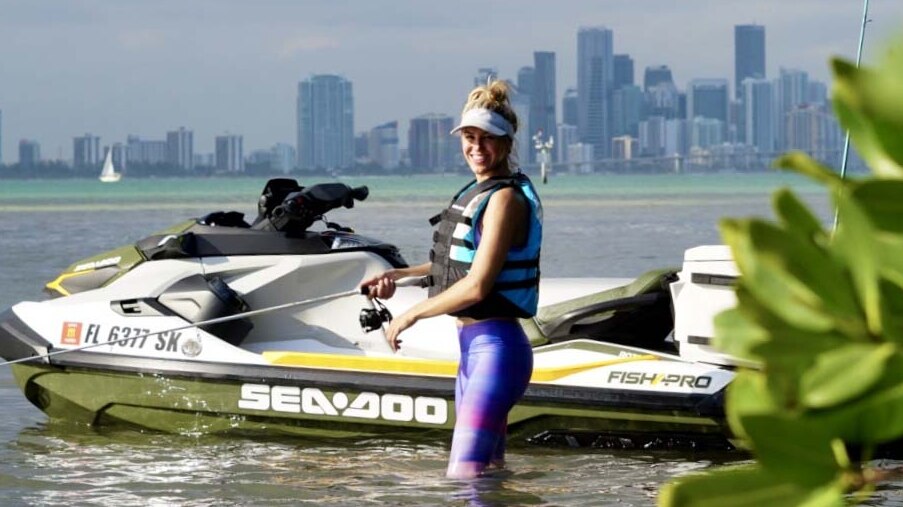 Bri Andrassy fishing beside her Sea-Doo Fish Pro