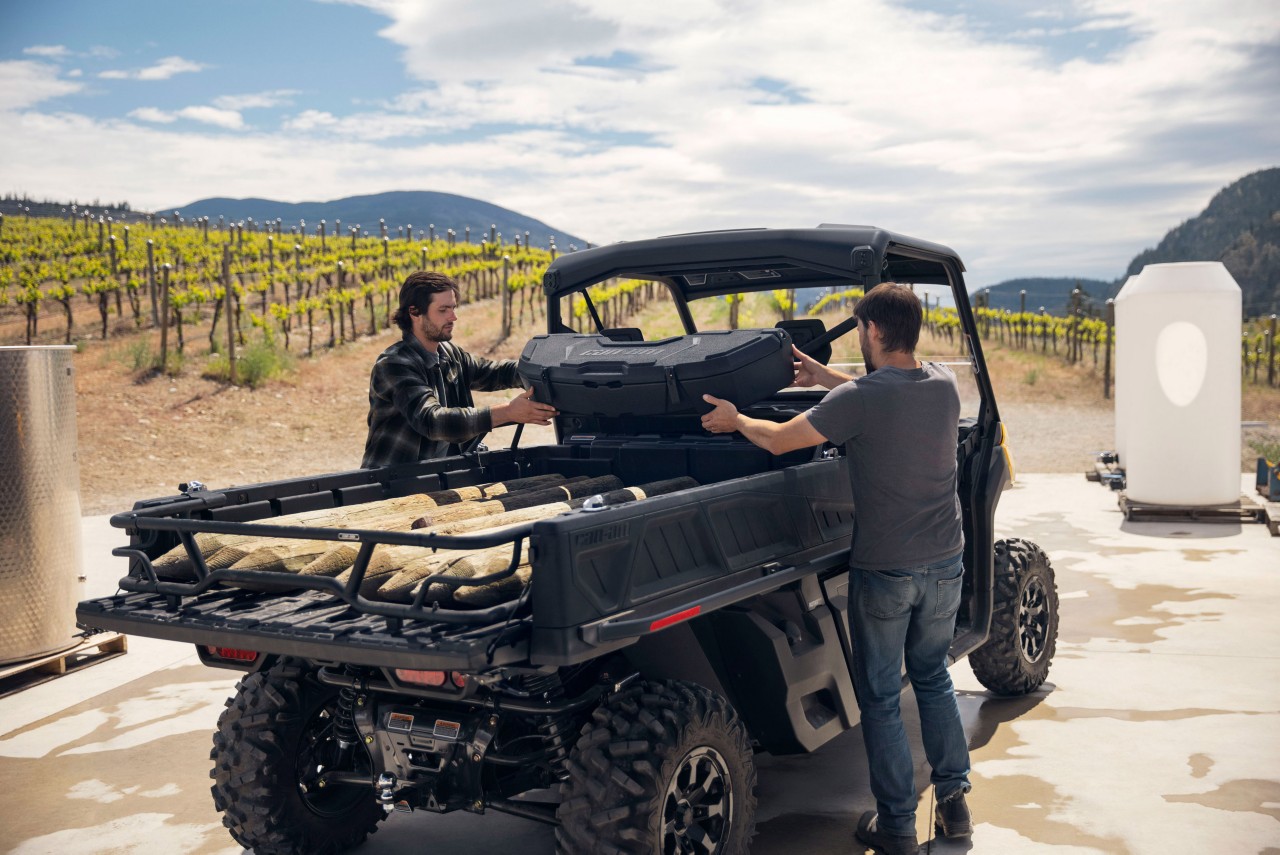 Two men loading a Traxter PRO