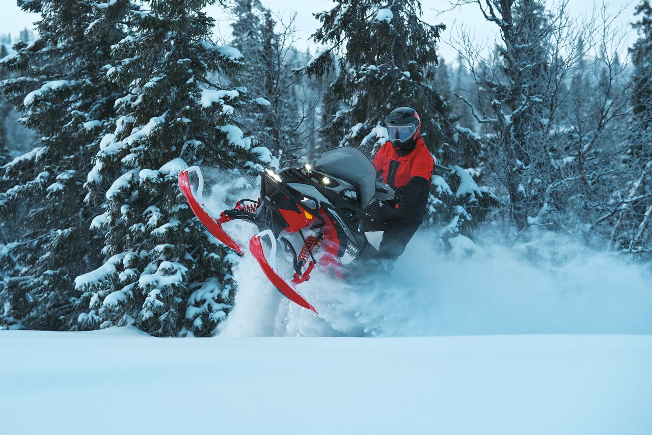 Rider in a mid-air on a 2027 Lynx Brutal RE snowmobile