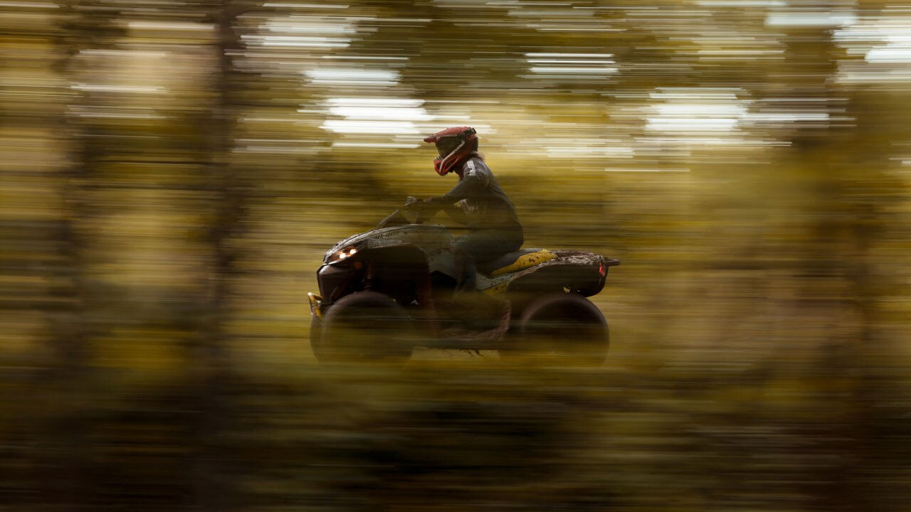 A Can-Am Renegade with blurred surroundings