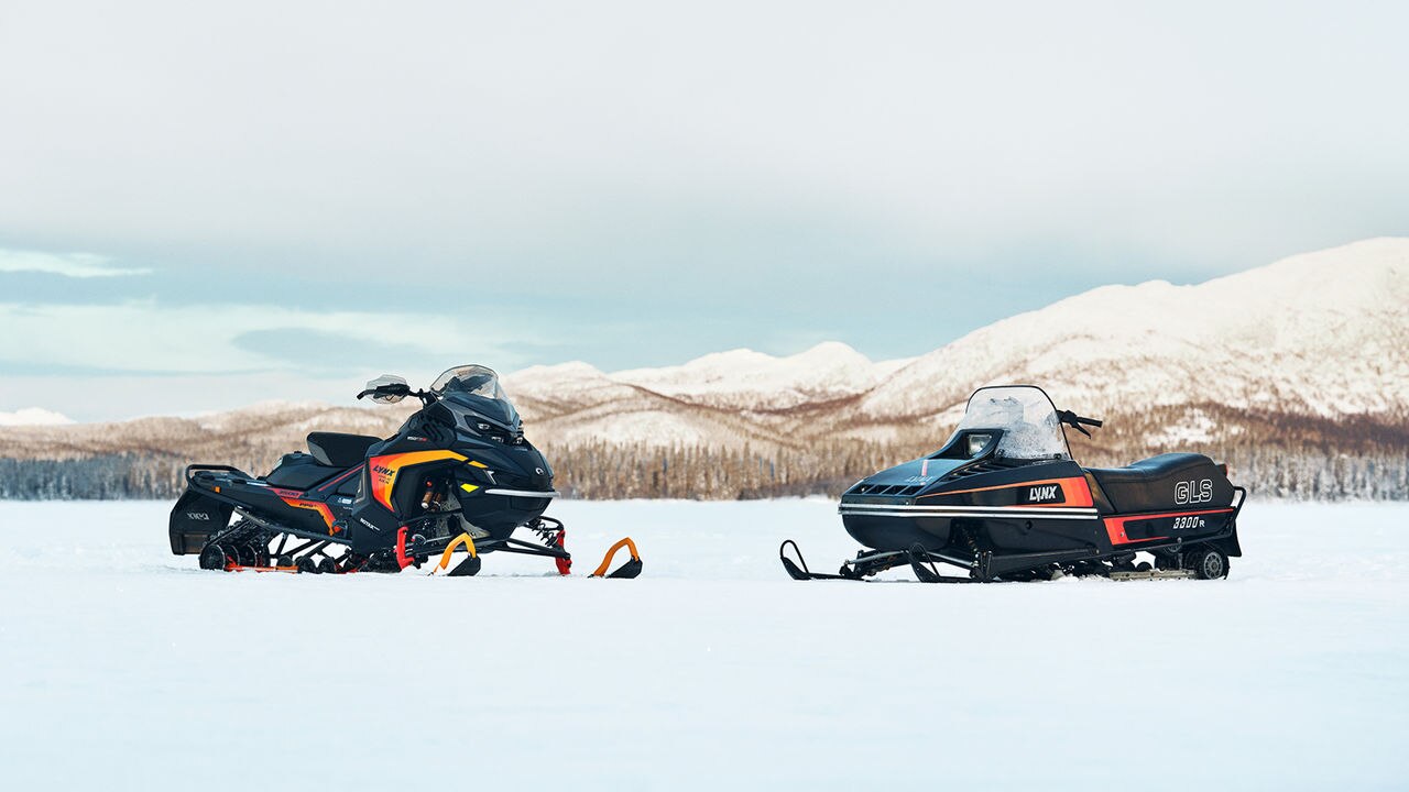 Lynx Rave GLS 2025 and retro Lynx GLS 3300 snowmobile on the lake ice