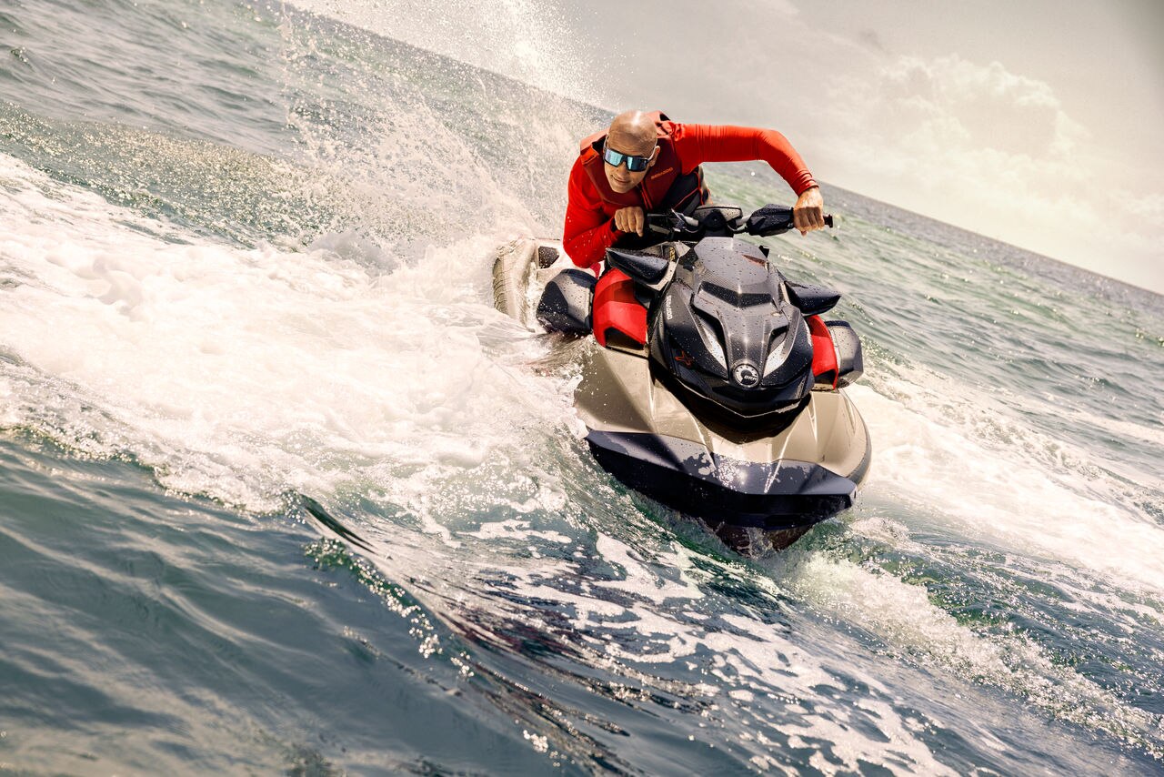Woman riding a Sea-Doo RXT-X 325 at high speeds