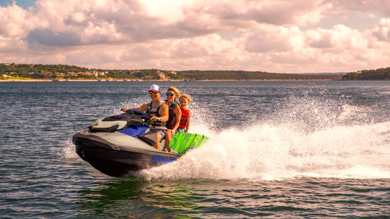 Woman pulling off a trick on a 2025 Sea-Doo Spark Trixx personal watercraft