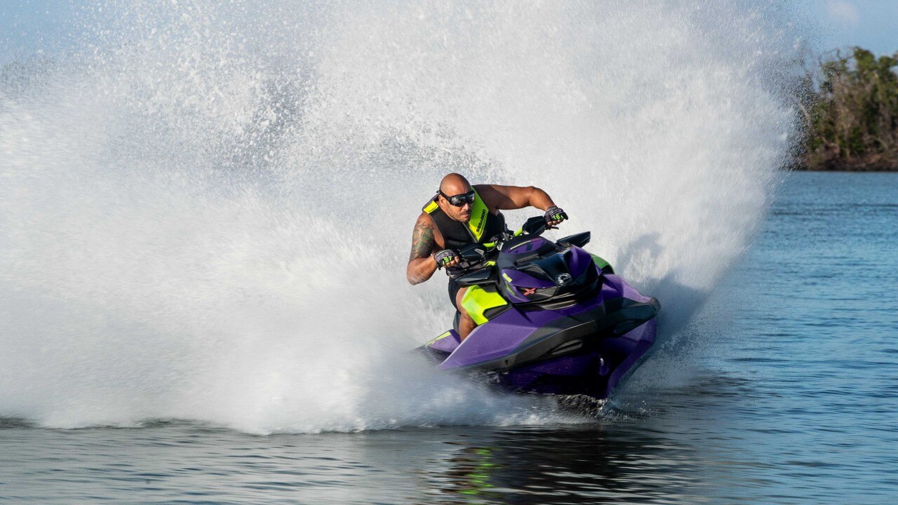 Men speeding with a Sea-Doo RXP-X