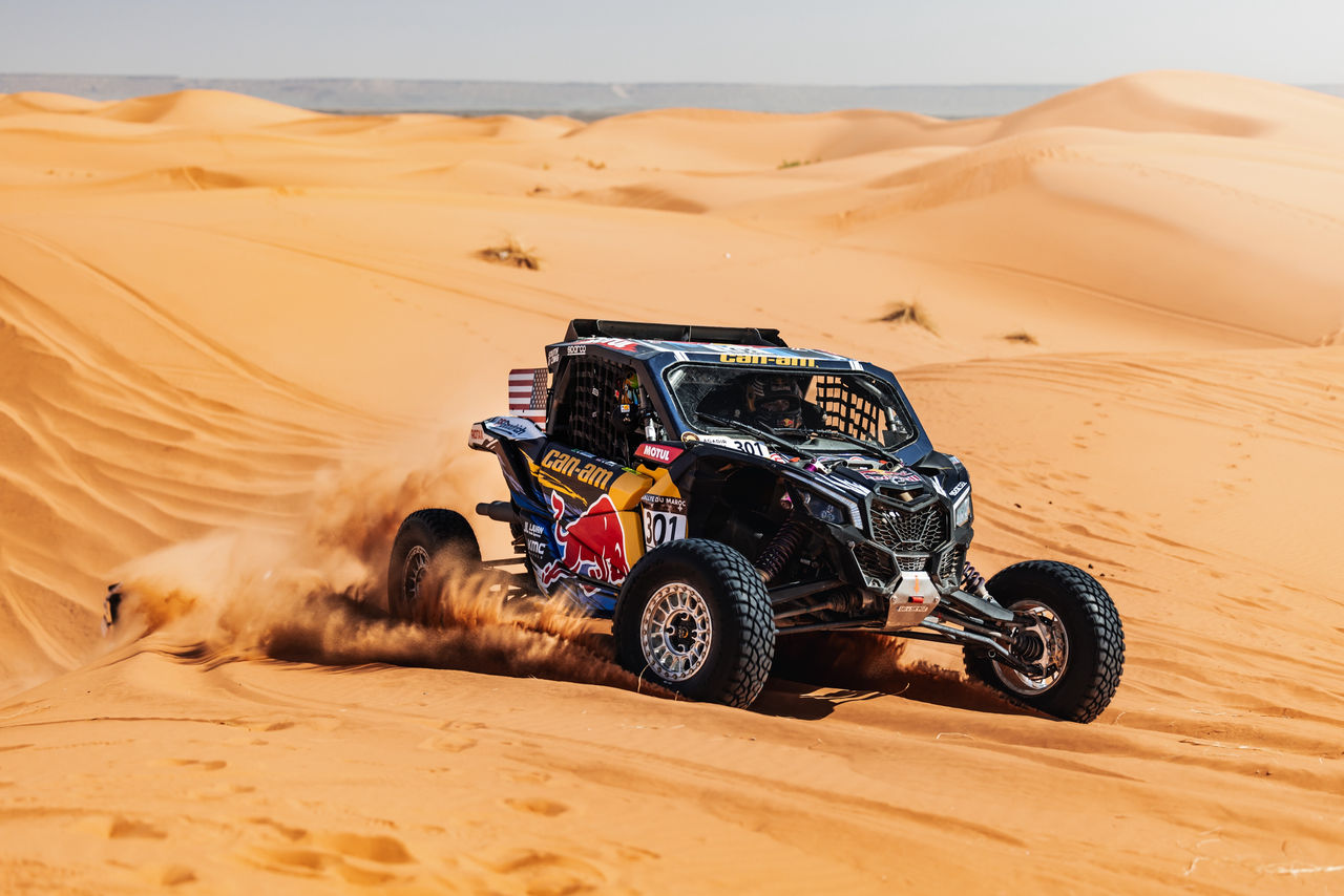 A Can-Am Maverick conquering the dunes of Dakar Rally