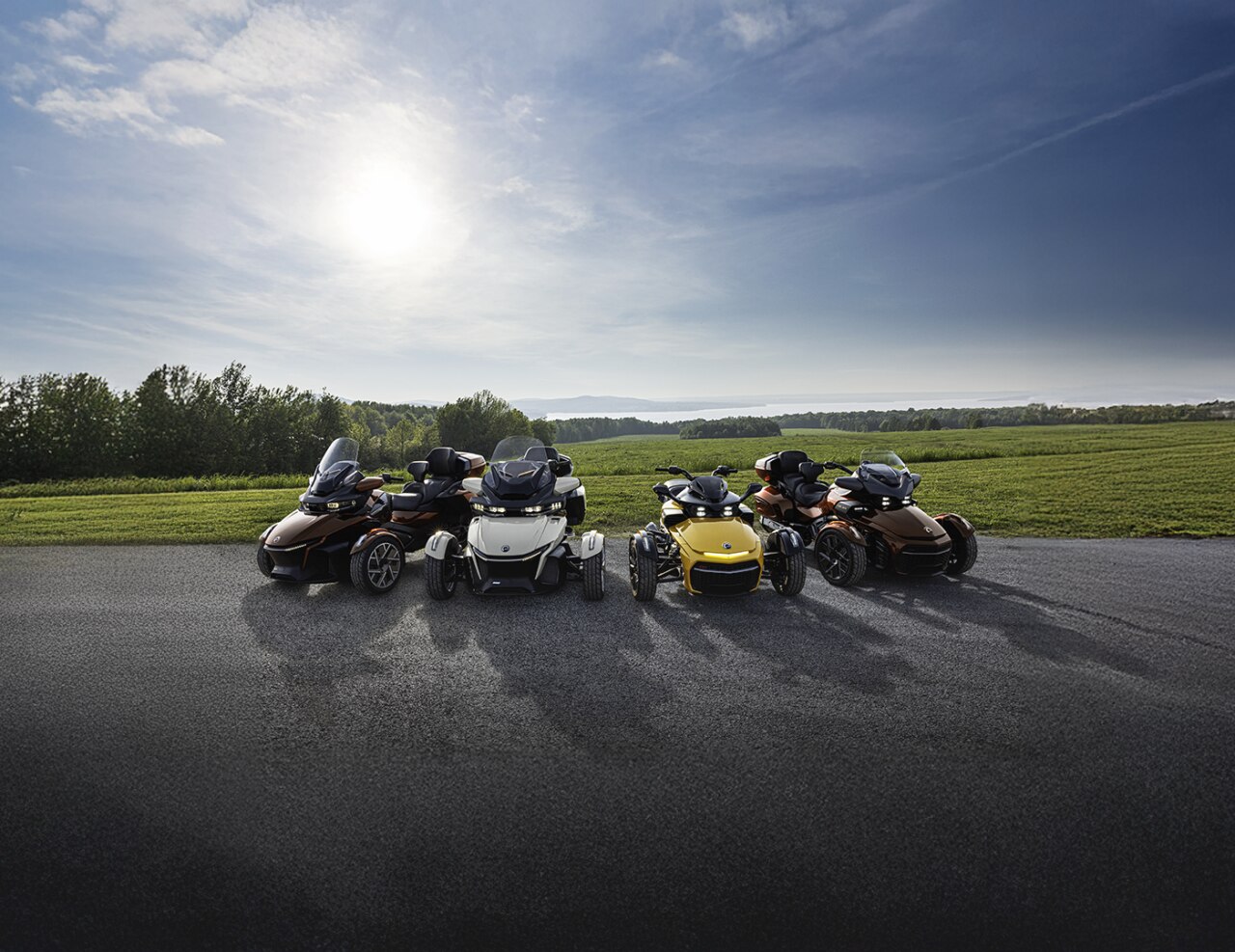 All Can-Am three-wheel motorcycles parked side by side