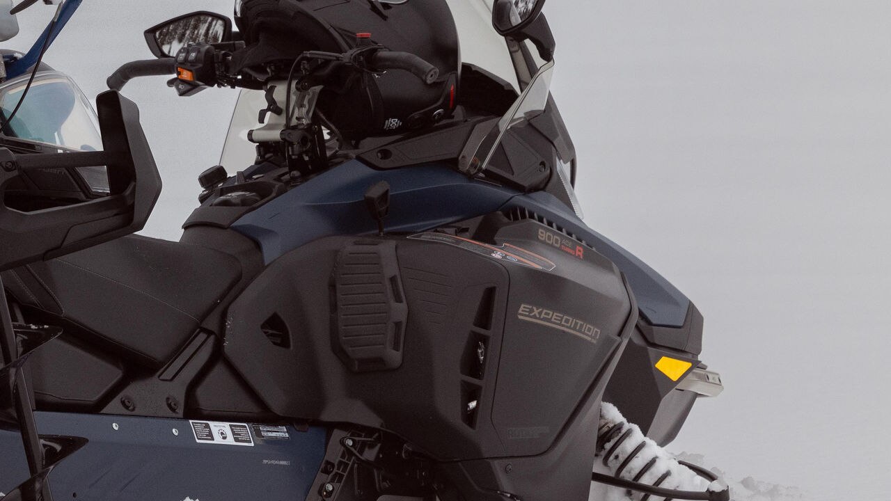 Knee pad protector installed on a 2025 Ski-Doo Expedition crossover snowmobile