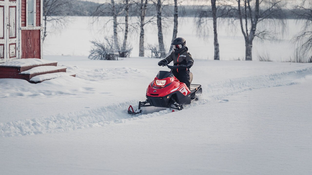 Kids riding on the yard with Lynx Rave 200