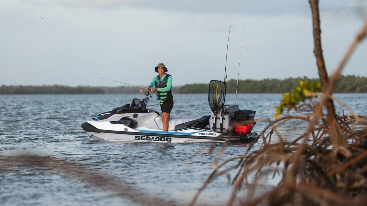 Woman fishing on her Sea-Doo Fish Pro with LinQ accessories