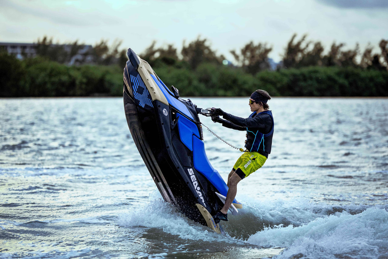 Three friends having fun riding a Sea-Doo Wake Pro
