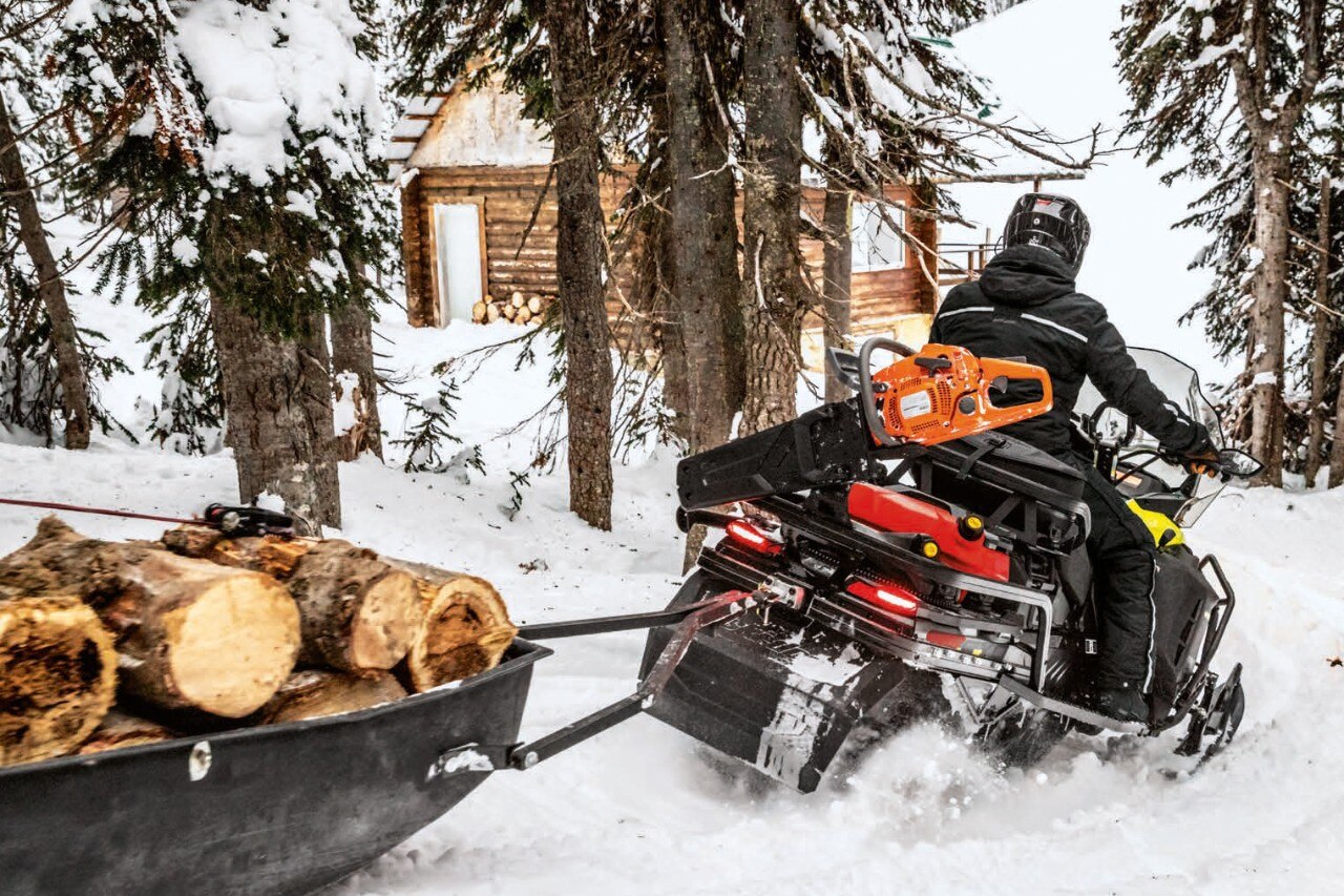 Man riding a Ski-Doo snowmobile
