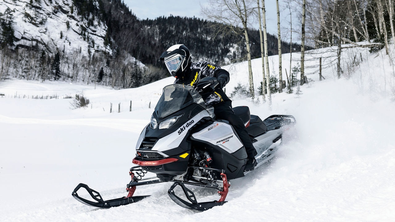 Man riding a Ski-Doo snowmobile