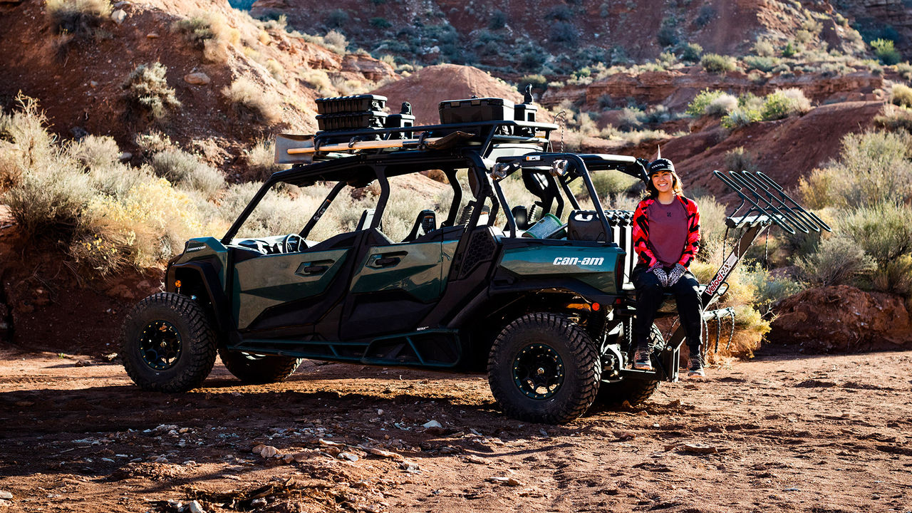 Samantha Soriano sitting down at the back of a Can-Am Commander and looking into the camera for a photo