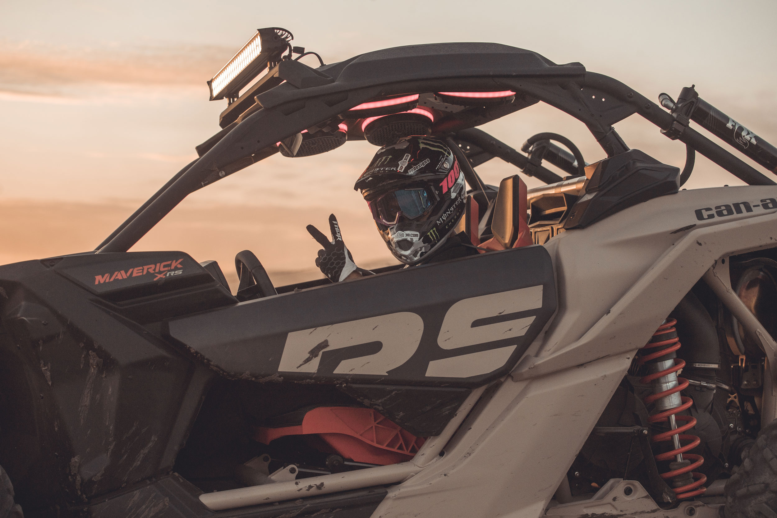 Man driving a Can-Am Maverick in the sand